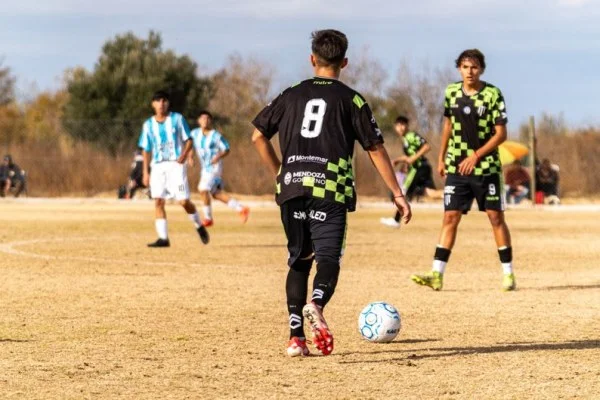 soccer striker shielding ball